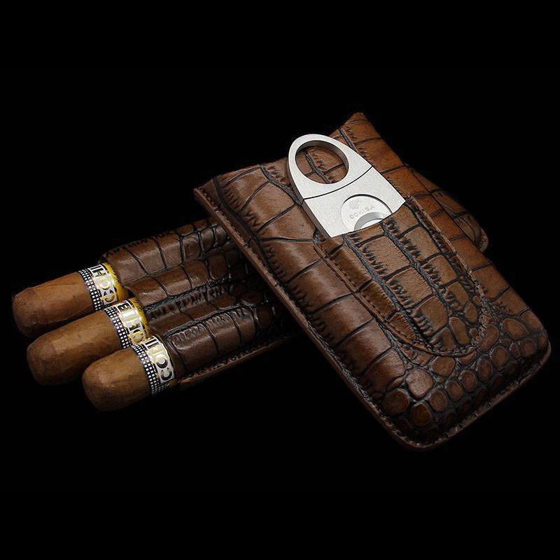 Luxury 3-cigar travel case made from genuine crocodile skin, featuring a built-in cigar cutter; elegant and durable design for cigar aficionados on the go.