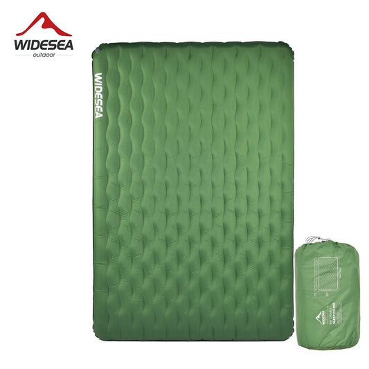 Inflatable green camping mattress with a texture surface, displayed next to its green carrying bag.