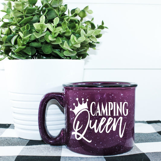 15oz ceramic campfire mug with “Camping Queen” graphic, perfect for outdoor coffee or cocoa lovers; durable, stylish, and made for campsite comfort.