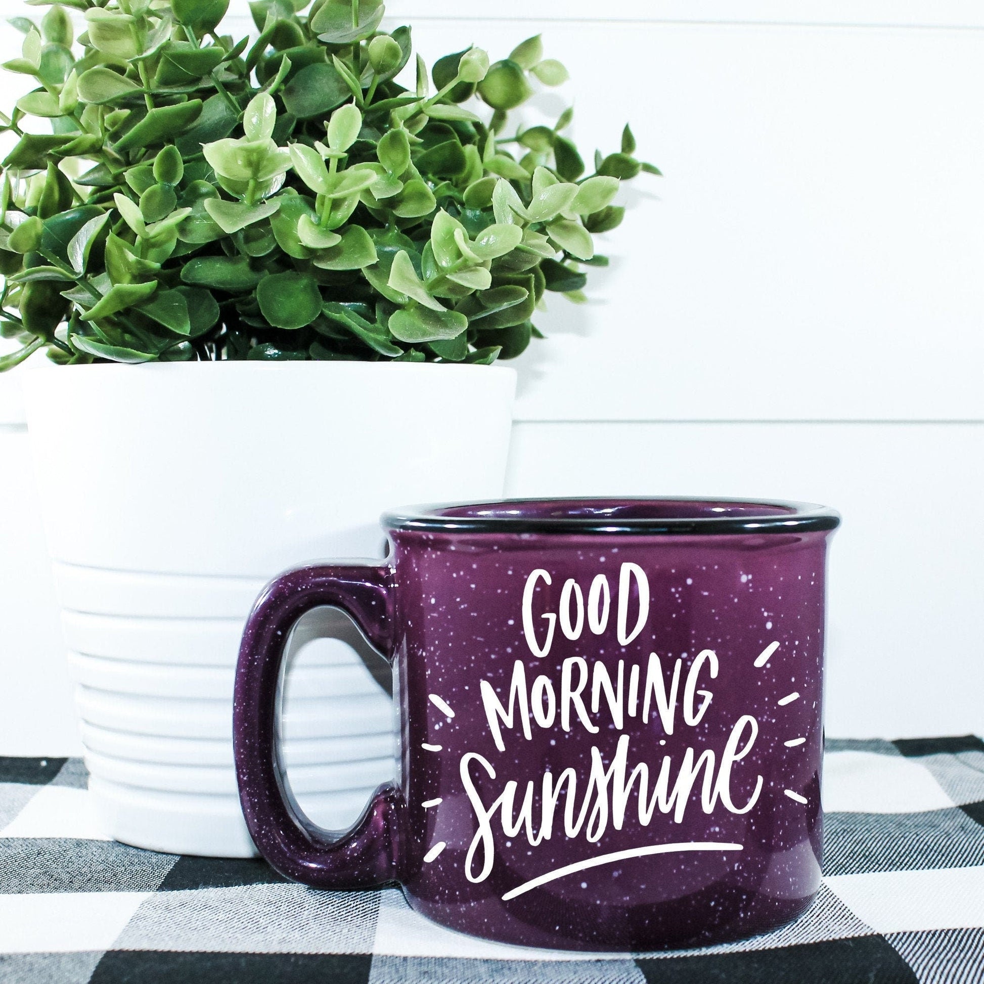 15 oz ceramic campfire mug with 'Good Morning Sunshine' vinyl design. Microwave safe and ideal for coffee, tea, or cocoa. Hand wash recommended to maintain print quality.