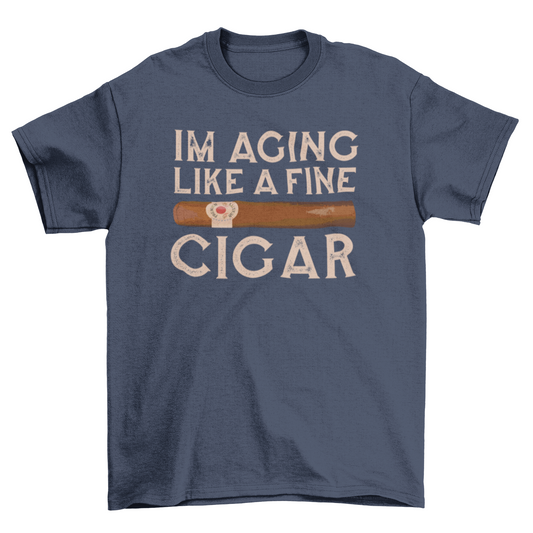 Vintage-style “I’m Aging Like a Fine Cigar” t-shirt with retro cigar graphic and bold typography; soft unisex fit, perfect gift for cigar lovers with a sense of humor.