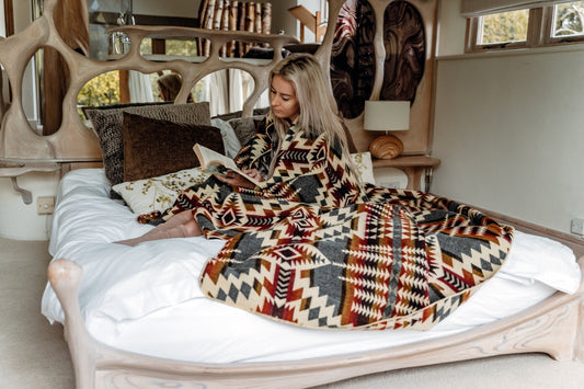 Secoya Blanket in Campfire Ash color with reversible hypoallergenic design handcrafted by Ecuadorian artisans perfect for camping home decor and cozy comfort