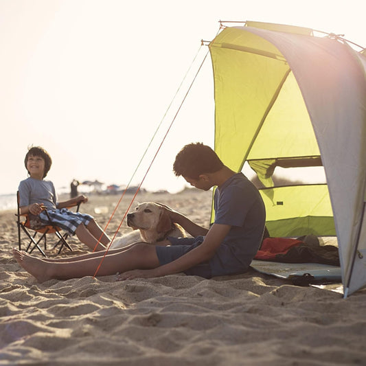 Super-Brella SPF 50+ canopy umbrella for sun, wind, and rain protection; portable all-weather shelter ideal for beach, camping, and sports events.