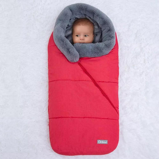 A baby sleeping bag in red with a gray faux fur collar, designed for use in strollers or as a sleep sack.