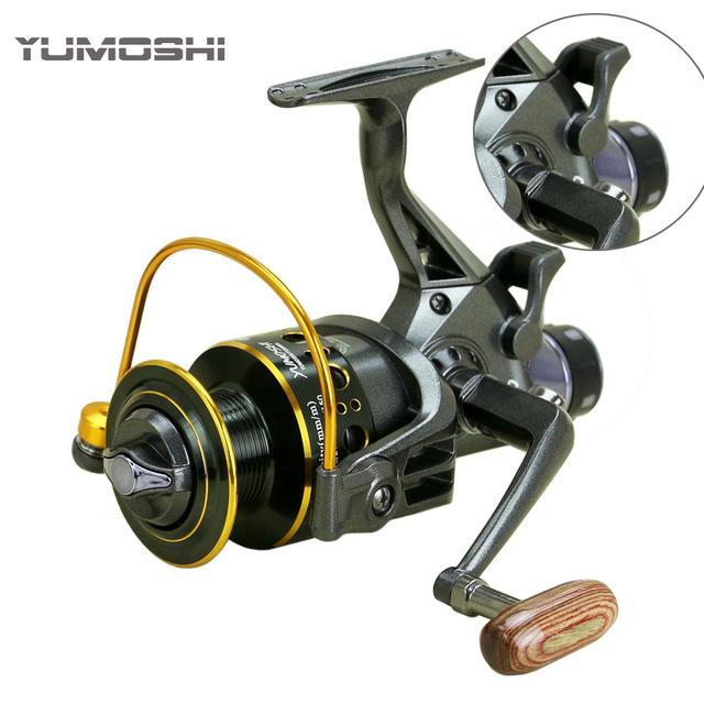 Yumoshi MG 2018 double brake spinning reel with 11 ball bearings and 4000 spool capacity. Durable black design for saltwater and freshwater fishing. Ideal for carp, trolling, and fly setups.